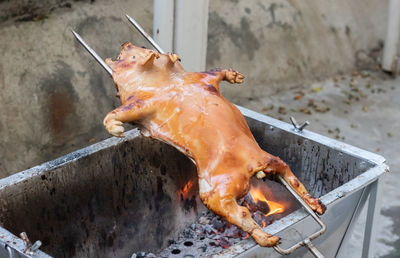 High angle view of meat on barbecue grill