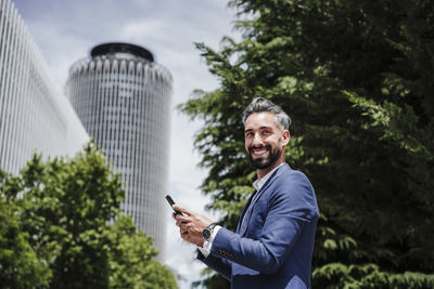 Portrait of man using smart phone