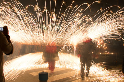 Firework display at night