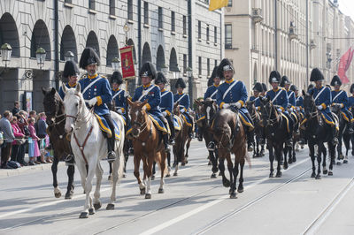 Group of people on street in city