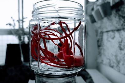 Close-up of glass jar on table