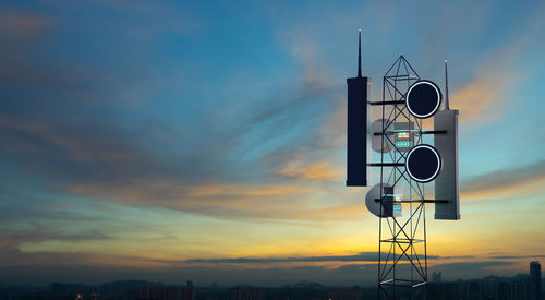 Low angle view of tower against sky during sunset