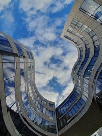 Low angle view of building against cloudy sky