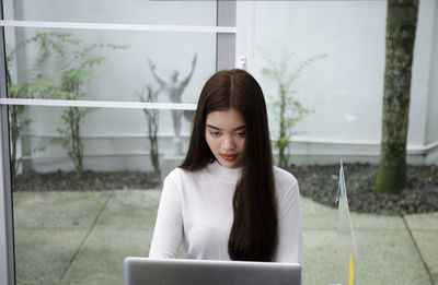 Young woman using digital tablet