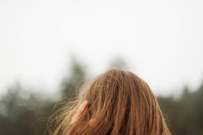 Rear view of woman against sky