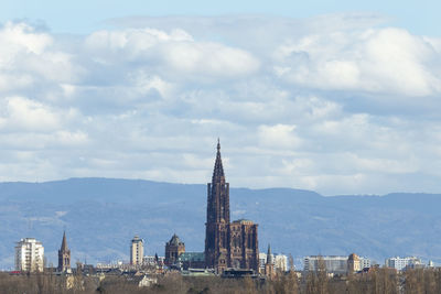 Panoramic view of buildings in city against sky