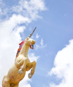 Low angle view of statue against sky