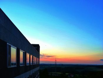 Built structure against sky at sunset