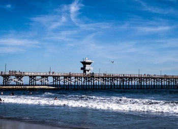 Pier over sea against sky