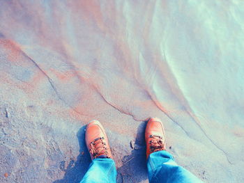 Low section of man standing on floor