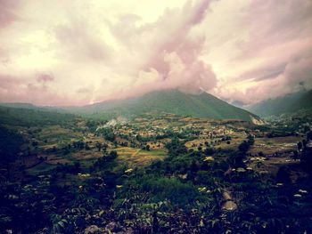 Scenic view of landscape against dramatic sky