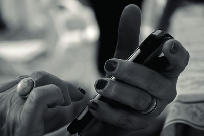 Cropped image of person holding smart phone