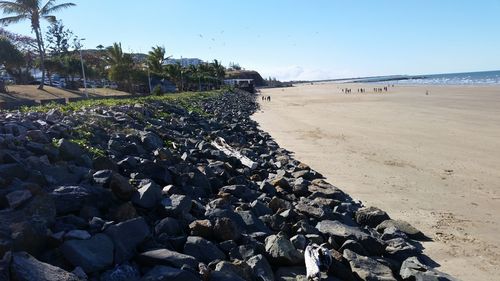 Scenic view of beach against clear sky