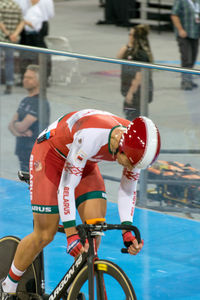 People riding bicycle in swimming pool