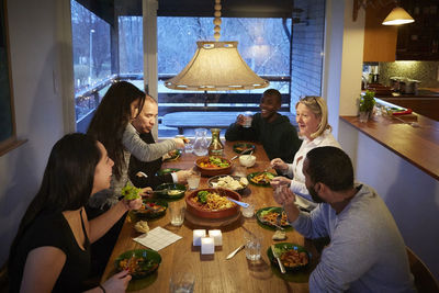 High angle view of multi-generation family enjoying meal at table