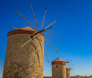 Low angle view of building against clear blue sky