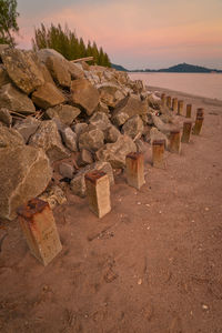 Scenic view of beach against sky during sunset