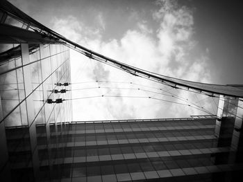 Low angle view of building against cloudy sky