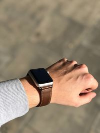 Close-up of hand with wristwatch