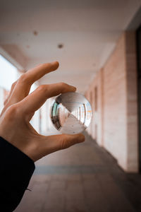 Close-up of hand holding glass