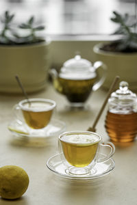 Tea drinking in transparent glass dishes