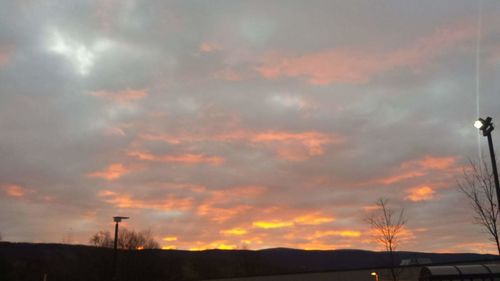 Low angle view of cloudy sky at sunset