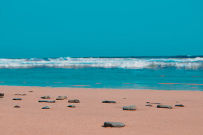 Scenic view of sea against clear blue sky