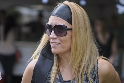 Close-up of mature woman wearing sunglasses while standing outdoors