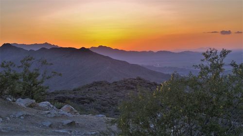 Scenic view of mountains against sky during sunset