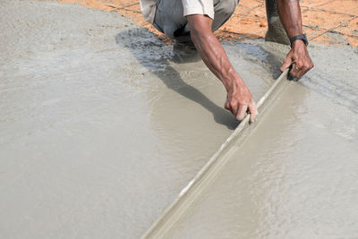 Low section of people working in water