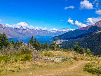 Scenic view of mountains against blue sky