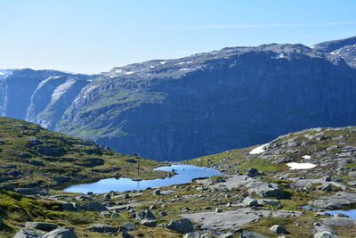 Scenic view of mountains against clear blue sky