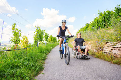 People riding bicycle on road
