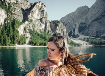 Portrait of young woman in lake