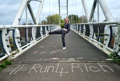 High angle view of man walking on footbridge