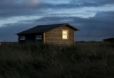 House on field against sky