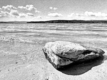 Scenic view of sea shore against sky