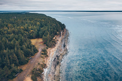 High angle view of sea shore against sky