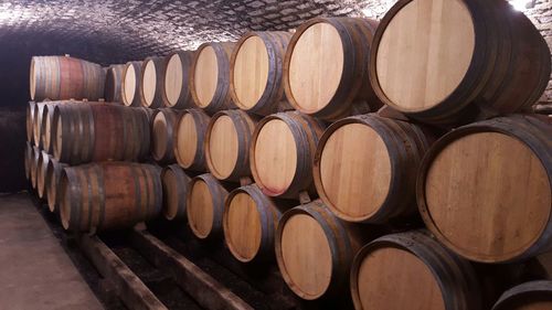 Stack of wooden barrels in room