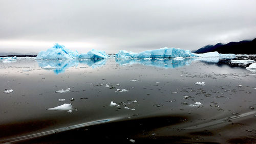 Scenic view of frozen sea against sky