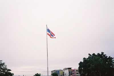 Low angle view of flag against sky