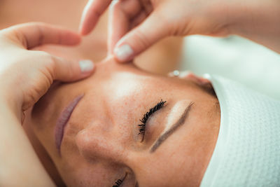 Face lifting massage, beautiful woman getting face lifting massage in a beauty salon.