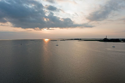 Aerial from the ijsselmeer near lemmer with the wouda pumping station at sunset