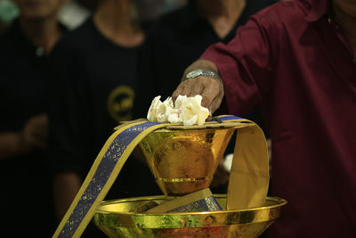 Close-up of man holding ice cream