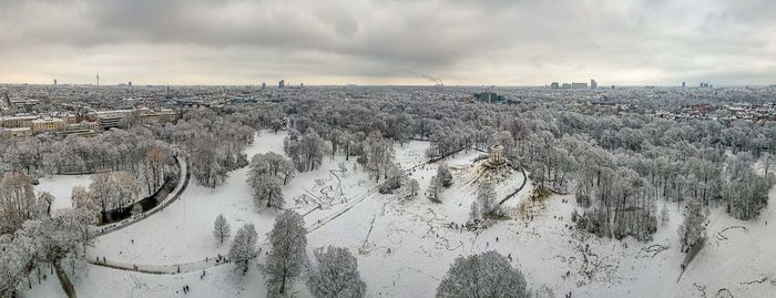 High angle view of snow covered cityscape against sky