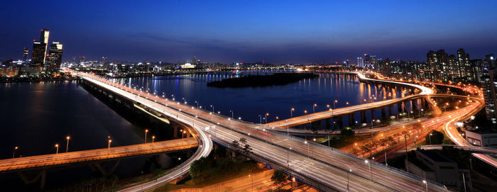 High angle view of light trails on highway at night