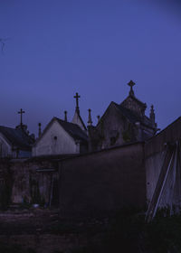 Old building against clear blue sky at dusk