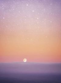 Scenic view of moon against sky during sunset