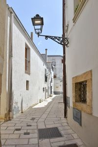 A narrow street among the old houses of irsina in basilicata, region in southern italy.