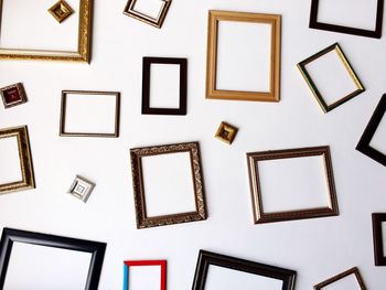 Picture frames on white wall
